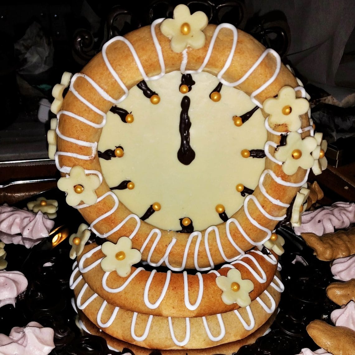 Danish Kransekage tower - marzipan wreath cake or ring cake - a recipe for a classic Danish cake. Use it for weddings, Christmas, New Year, or any party that needs a fancy cake. Find recipes and inspiration @ danishthings.com #DanishThings #kransekage # marzipanwreathcake #ringcake #Danish #tradition #weddingcake #NewYear #christmas #cake #party #classic #festive #tower