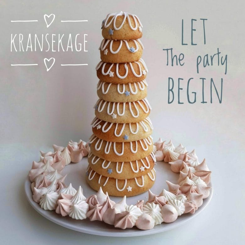 Danish Kransekage tower - marzipan wreath cake or ring cake - a recipe for a classic Danish cake. Use it for weddings, Christmas, New Year, or any party that needs a fancy cake. Find recipes and inspiration @ danishthings.com #DanishThings #kransekage # marzipanwreathcake #ringcake #Danish #tradition #weddingcake #NewYear #christmas #cake #party #classic #festive #tower