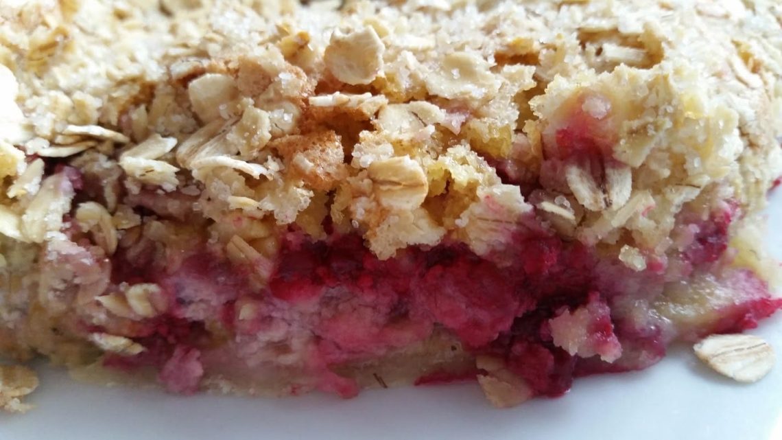 A piece of raspberry tart with marzipan